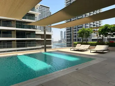 a swimming pool on the roof of a building at Golden Coast Stay in Dubai