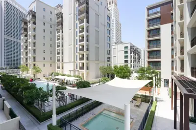 an aerial view of a city with tall buildings at Livbnb-Elegant 2BR, Creek Beach, Pool & Gym in Dubai