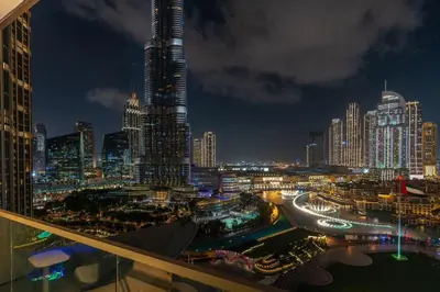 a view of a city skyline at night at Luxury Stay with Burj views in Dubai