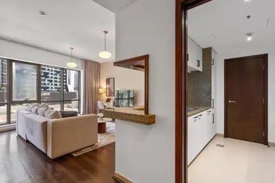 a living room with a couch and a table at Exceptional 1-bedroom with pool view in Downtown in Dubai