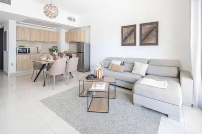 a living room with a couch and a table at Frank Poretr - AG Tower in Dubai