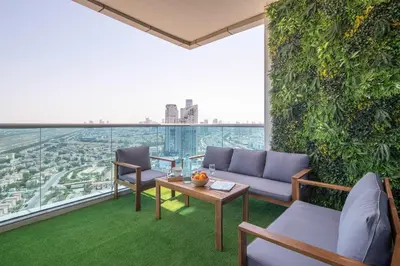 a living room with a couch and a table at Frank Porter - Al Jawhara Tower in Dubai