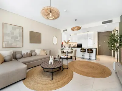 a living room with a couch and a table at Stunning Central 2BR Lagoon View & Private Beach in Dubai