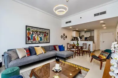 a living room with a couch and a table at Ocean Heights Dubai Marina Ocean View in Dubai