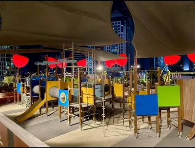 a restaurant with colorful chairs and tables in a building at Burj Khalifa View 5 Mins Walk to Dubai Mall in Dubai