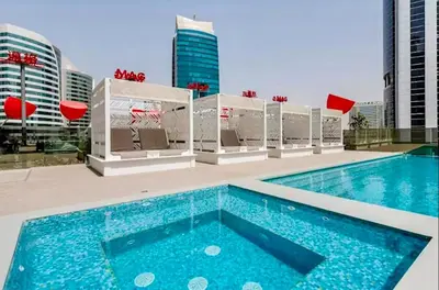 a swimming pool on the roof of a building at Burj Khalifa View 5 Mins Walk to Dubai Mall in Dubai