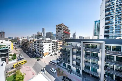 an aerial view of a city with tall buildings at Stylish 1BR with large Terrace JVC in Dubai