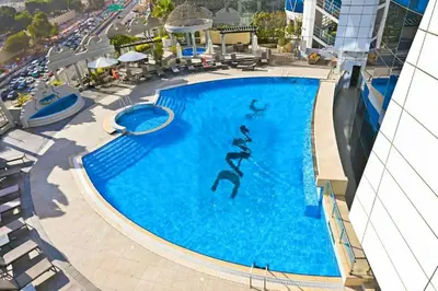 an overhead view of a swimming pool on a cruise ship at Vogue DIFC Damac Park Tower near Museum of The Future, One Bedroom Apartment with Balcony, City Skyline and Museum of The Future View, Access to all Amenities in Dubai
