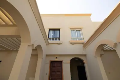 a building with two windows and a door at Designer Furnished Villa with Luxury Finishes in Springs 14 in Dubai
