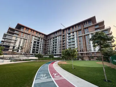 a rendering of a building with a park in front at Modern Serenity Central Park 2BR Escape-51 in Dubai
