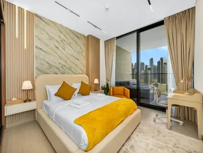 a bedroom with a bed and a large window at Premium Burj Khalifa View & Private Jacuzzi in Dubai