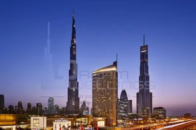 a view of a city skyline at night at Kempinski Central Avenue One Bedroom in Dubai