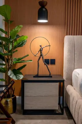 a statue on a table in a living room at Damac Maison - Impression by UDH in Dubai
