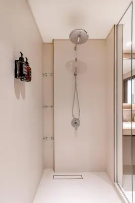 a shower in a bathroom with a glass door at Designer 2-BR - Sea View - Grand Bleu by Elie Saab in Dubai