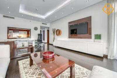 a living room with a couch and a tv at Keysplease Upgraded 1 BR Apt near Dubai Mall, Burj Views in Dubai