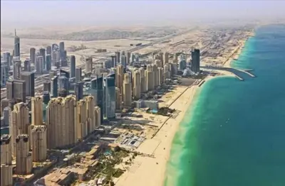 an aerial view of a city and the beach at Diamond Marina Inn, Heart of Marina in Dubai