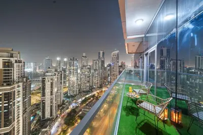 a view of a city from the top of a building at Sky-High Infinity Pool with Burj Khalifa Views in Dubai
