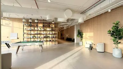 a large room with a ping pong table in it at The Gifted Cozy Home in Dubai