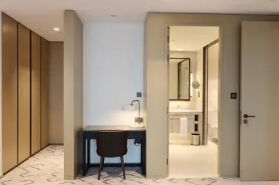 a bathroom with a desk and a bathroom with a shower at Livbnb - Premium 3BR with Burj Skyline View in Dubai