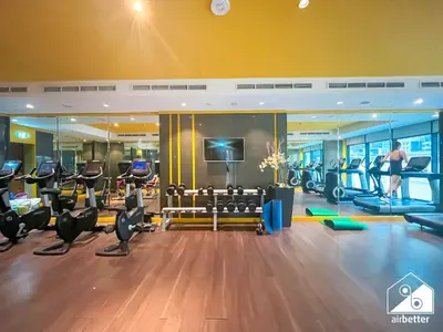 a gym with treadmills and cardio equipment in a building at Luxury 2BR in Merano Tower Panoramic City Views in Dubai