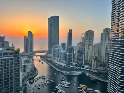 a view of a city with boats in the water at Golden Hour Stay Sea View in Marina Dubai in Dubai