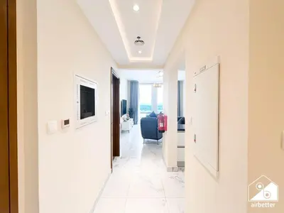 a corridor of a hotel room with a hallway at Stunning 2-Bedroom Apartment with Canal Views in Dubai