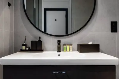 a bathroom sink with a large mirror above it at 5 Star Apartment Dubai Burj KhalifaView in Dubai