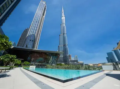 a view of the burj khalifa and the city at 2BR Next to Burj Khalifa& Dubai Mall in Grande Residence in Dubai