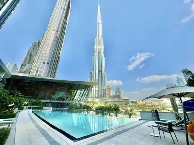 a swimming pool with a view of the city at 2BR Next to Burj Khalifa& Dubai Mall in Grande Residence in Dubai