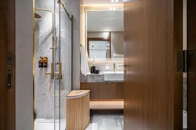 a bathroom with a shower and a sink at Trillionaire Bayhouse - Chic 1BR with Views, Pool and Gym in Dubai