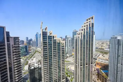 a view of a large city with tall buildings at Comfy 2BR Act 1 Near Dubai Mall in Dubai