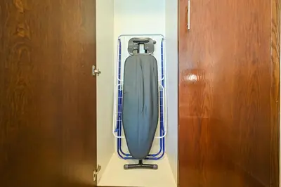 a blue object is in a room next to a door at Stylish 1BR in 8 Boulevard Walk in Dubai