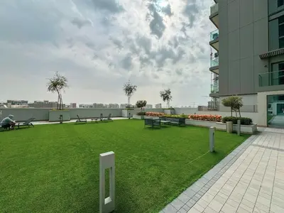 a park on the roof of a building with benches at Lux 1 Bed room partment in Sobha Creek Vistas Reserve tower at 9th floor in Dubai