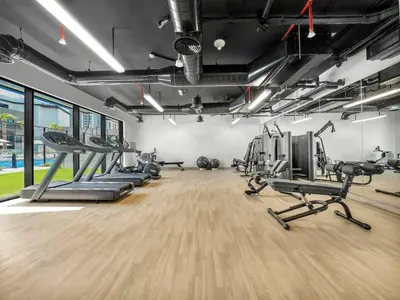 a gym with treadmills and cardio machines at Brand New Luxury 2Bedroom in JVC with 5 Star Amenities in Dubai