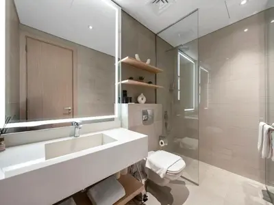 a bathroom with a sink and a shower and a toilet at Brand New Luxurious 2 Bed in JVC with Padel Court in Dubai