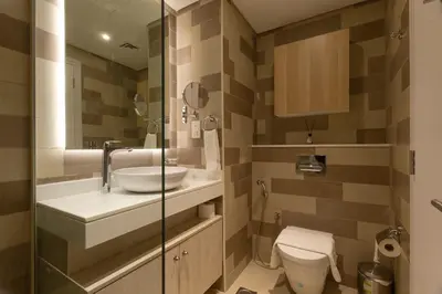 a bathroom with a sink and a toilet at Sea-View Studio at Seven Palm in Dubai