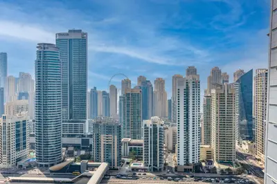 a view of a large city with tall buildings at White Sage High Floor 1BR Metro Access JLT in Dubai