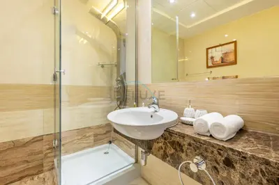 a bathroom with a sink and a shower at Few Metres from Marina Beach, Arabian Gulf Views - Trident Grand Residences, Dubai Marina by Deluxe Holiday Homes in Dubai