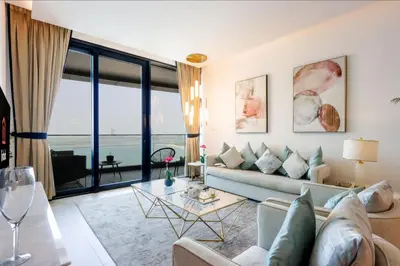 a living room with a couch and a table at Livbnb Beachfront 2BR in Address JBR Sea & Ain Dubai Views in Dubai
