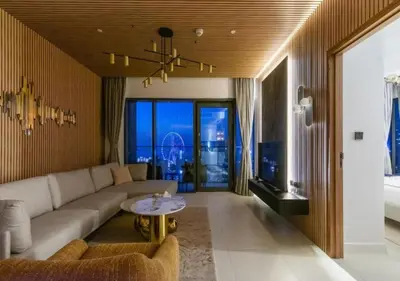a living room with a couch and a table at Novity Signature Homes in Dubai