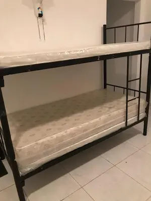 a metal bunk bed in a room with at hostel in Dubai