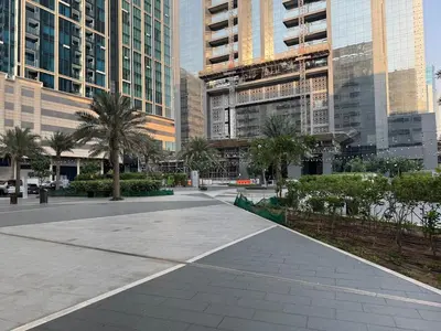 a street in a city with tall buildings at Affordable master bedroom hotel apartment in Dubai