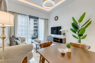 a living room with a couch and a table at GLOBALSTAY Azizi Riviera 59 in Dubai