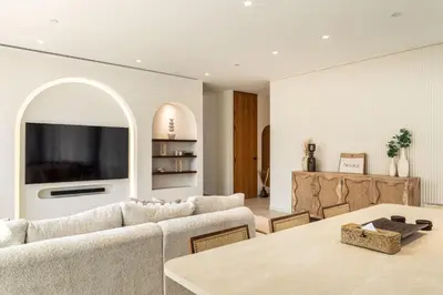 a living room with a couch and a table at Seraya at Residence 110 in Dubai