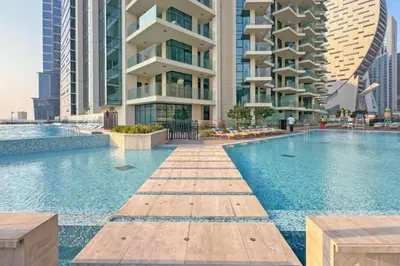 a swimming pool in the middle of a building at Seraya Residences at Urban Oasis by Missoni in Dubai