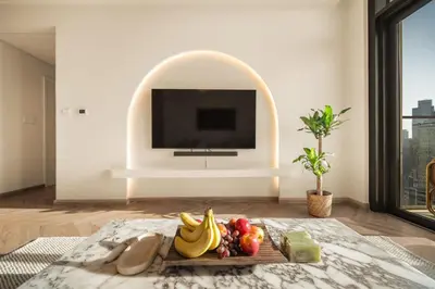 a tray of fruit on a table in a living room at Seraya Residences at Burj Crown in Dubai