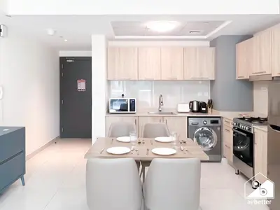 a kitchen with a table and chairs in a room at Amazing Stay in AG Tower , Business bay in Dubai