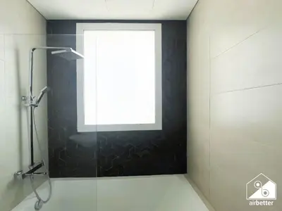 a bathroom with a shower with a window at Luxury At AG Tower Business Bay & City Views in Dubai
