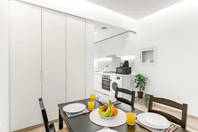 a dining room with a table with fruit on it at Business Bay Studio Near Dubai Mall, Burj Khalifa & Downtown Hotspots in Dubai