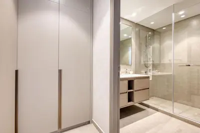 a bathroom with a shower and a sink at Top floor Grande 2BR Luxe Panoramic Sea View BohemianStyle in Dubai